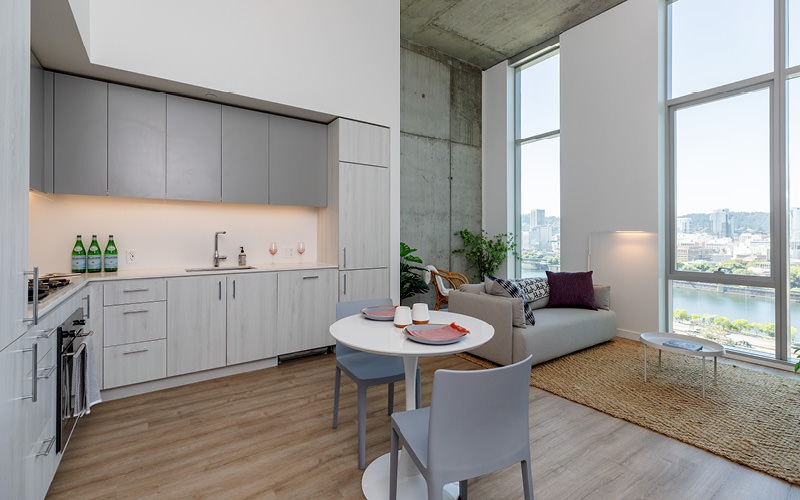 a kitchen with a table and chairs