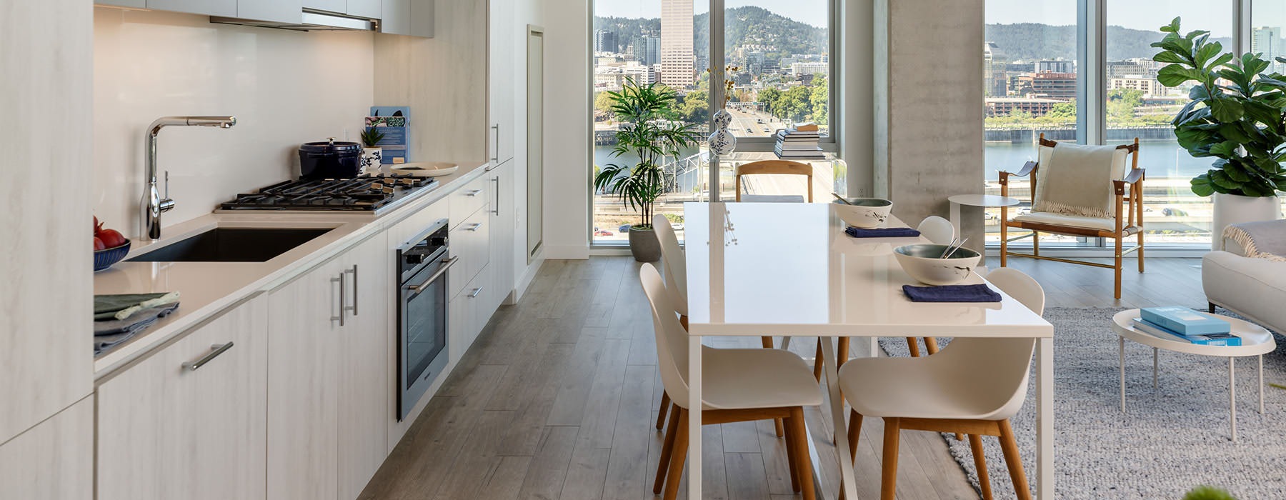 floor-to-ceiling windows in open concept apartment