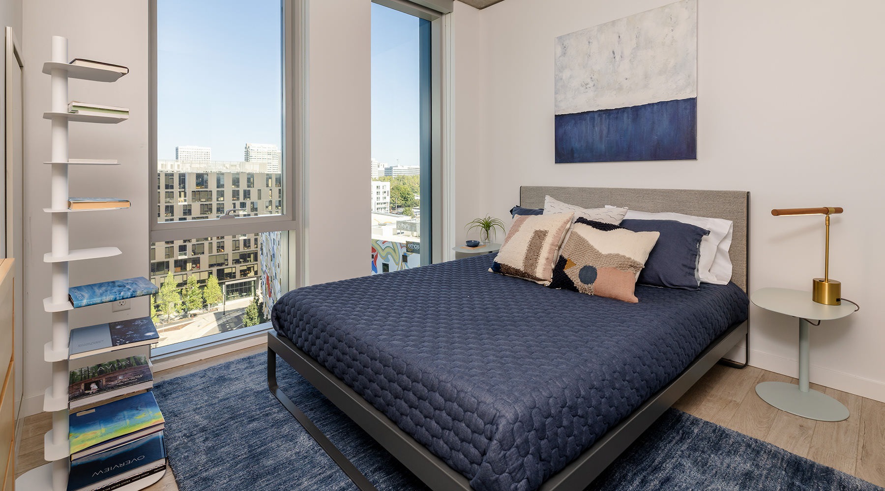 bedroom with floor-to-ceiling windows next to bed