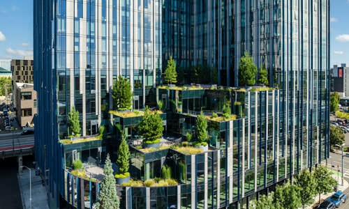 green, plant filled terraces along building