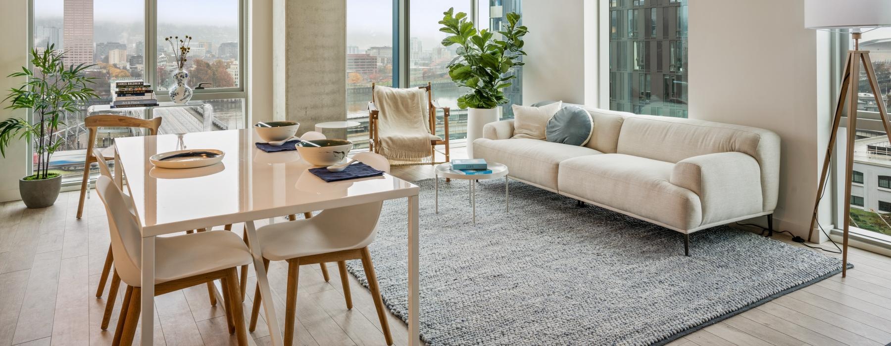 floor-to-ceiling windows in open concept apartment